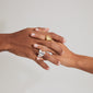 Hands adorned with Pilgrim's adjustable gold-plated SEA ring, showcasing a fossil-inspired motif.