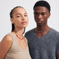 TRUST necklace silver-plated with red Agate and organic shapes, worn by a woman with braids, offering a lux boho look for fall.