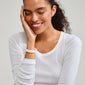 ECLIPSE bangle white on woman's wrist; ivory recycled acrylic bangle with simple, trendy design, ideal for stacking.