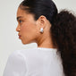 Silver-plated ECLIPSE hoops by Pilgrim, inspired by nature's organic shapes, elegantly worn by a woman with long hair and diamond earrings.