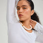 ECLIPSE necklace white/silver-plated worn by a woman, showcasing chunky ivory beads for a stylish, earthy look.