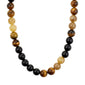 UNFOLD necklace gold-plated/brown features chunky tiger's-eye beads and a decorative clasp, blending earthy tones with a luxurious touch for autumn style.