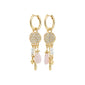 SHIFT hoop earrings gold-plated, featuring pavé crystal discs with pearl, pink stone, and gold dangles, embodying a boho-chic, whimsical elegance.