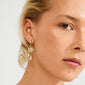 Blonde woman wearing Pilgrim's SHIFT hoop earrings, featuring a pavé-set disc, pearls, rose quartz, and charms, highlighting boho chic and whimsical elegance.