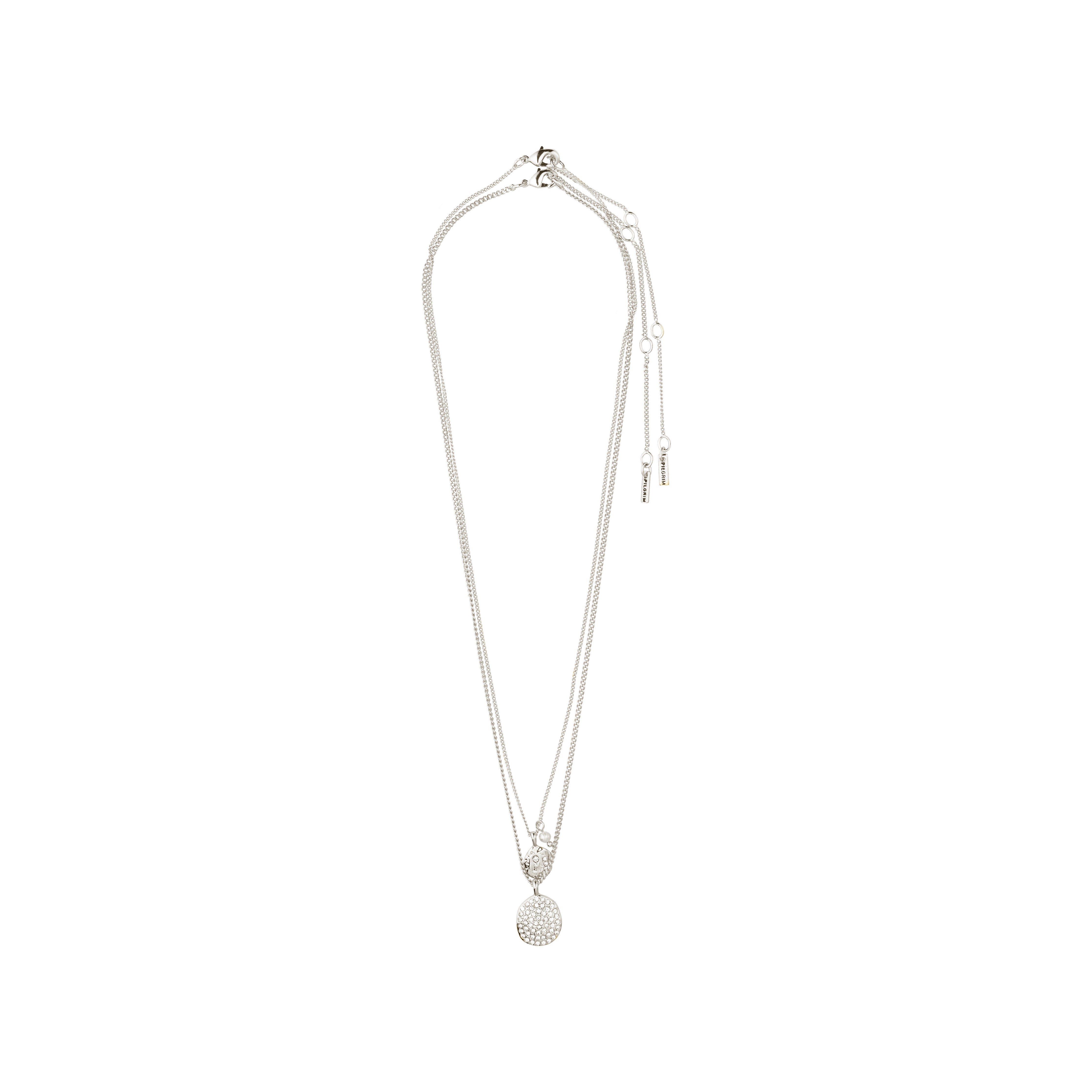 SHIFT necklace 2-in-1 set, silver-plated, features layered chains with heart and disc pendants, combining elegance and versatility for a stylish, recycled fashion statement.