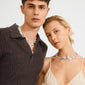 Young man and woman wearing Pilgrim's silver-plated SHIFT necklace, featuring chunky, irregular stone-like links for a bold, stylish look.
