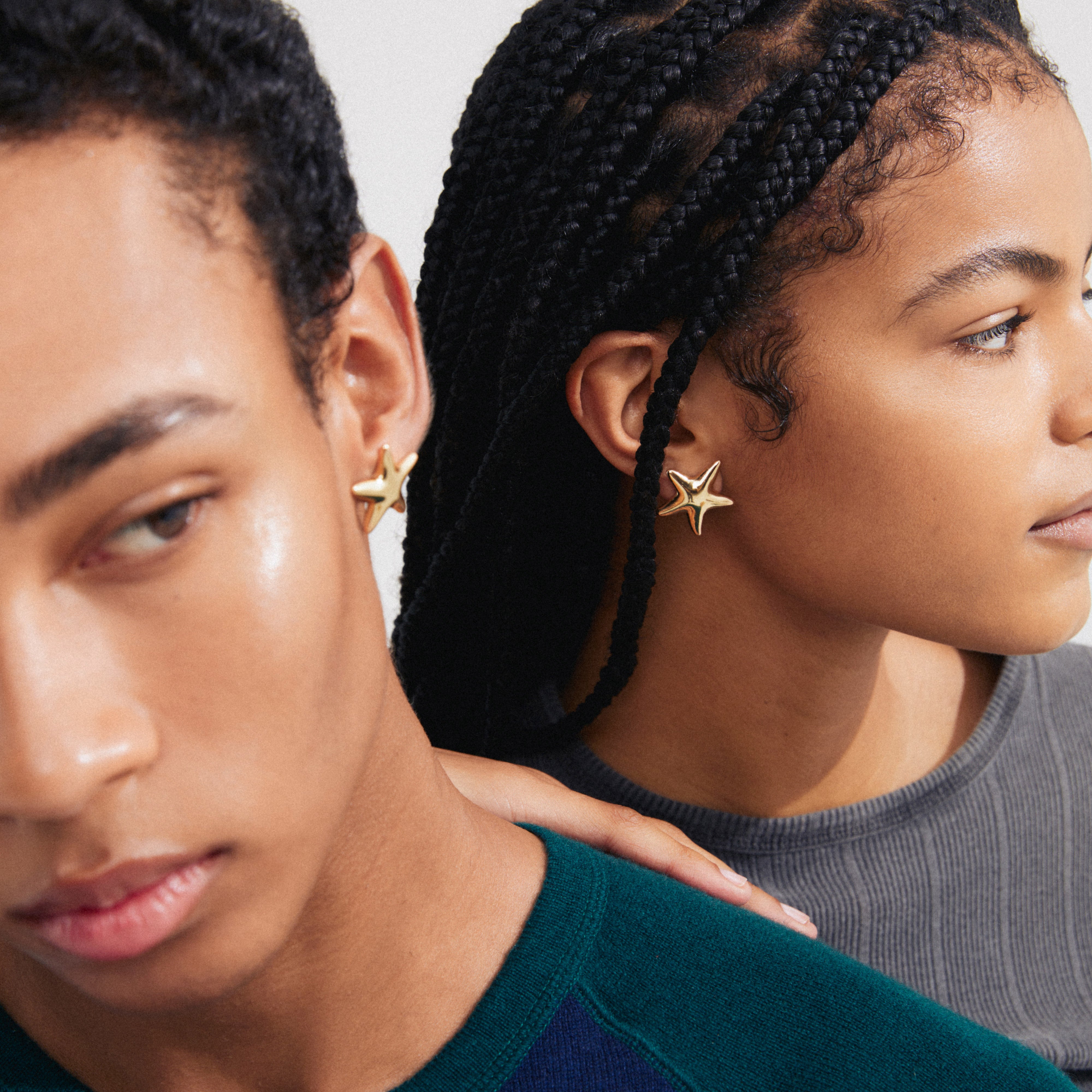 FORCE earrings gold-plated: Large starfish design, worn by a woman with braided hair, showcasing Pilgrim's bohemian vibe and sustainable craftsmanship.