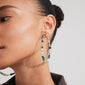 Woman wearing FORCE mega hoop earrings by Pilgrim, featuring semi-precious stones and silver-plated details, highlighting a stylish, summery look.