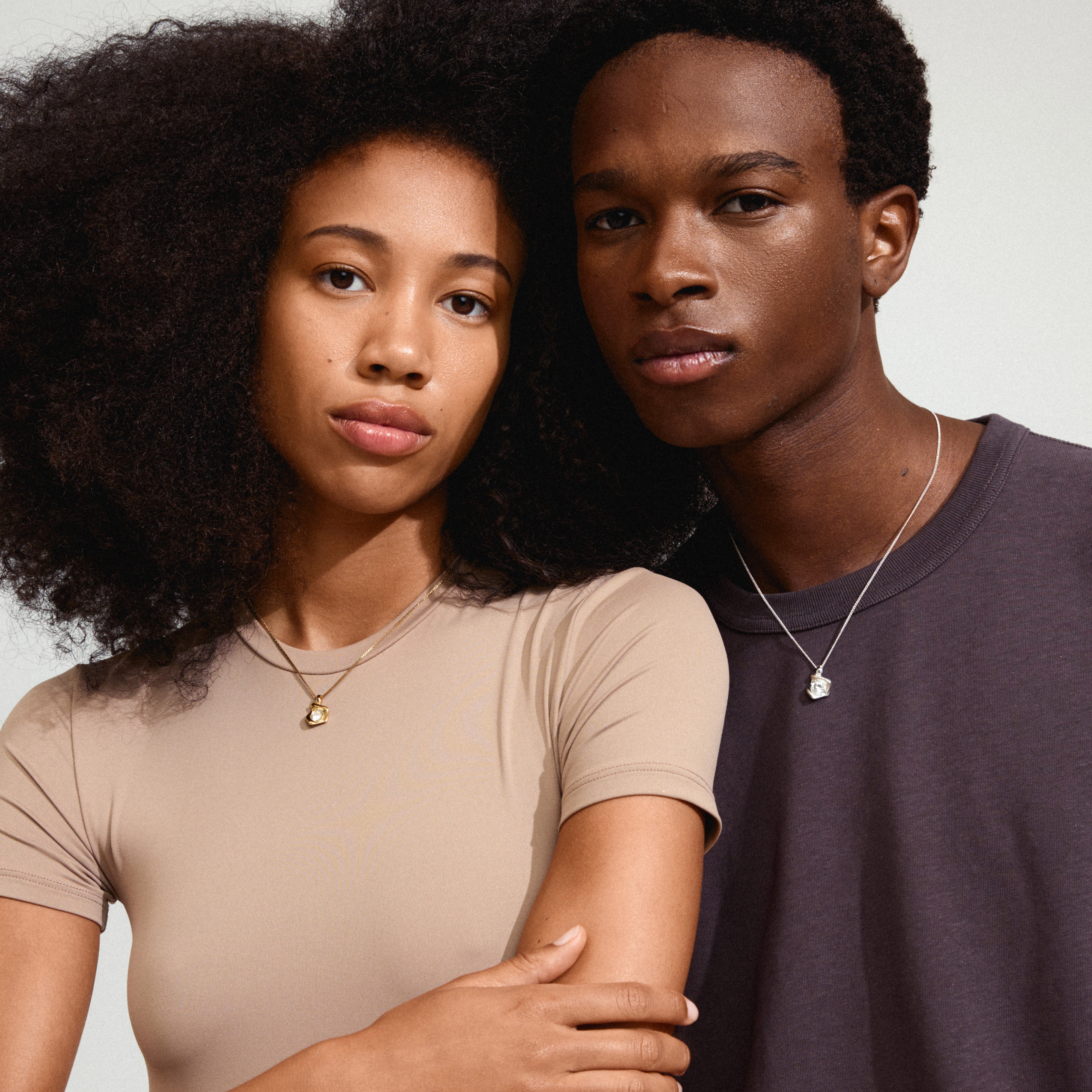 SUNSET crystal necklace silver-plated showcased by a woman, featuring a sleek box chain and a sparkling Preciosa crystal pendant, embodying Pilgrim's timeless Danish craftsmanship.