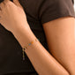 Close-up of Pilgrim's BETWEEN bracelet, gold-plated with semi-precious stones on a wrist, showcasing its luxe boho vibe and stylish, grounded appeal.