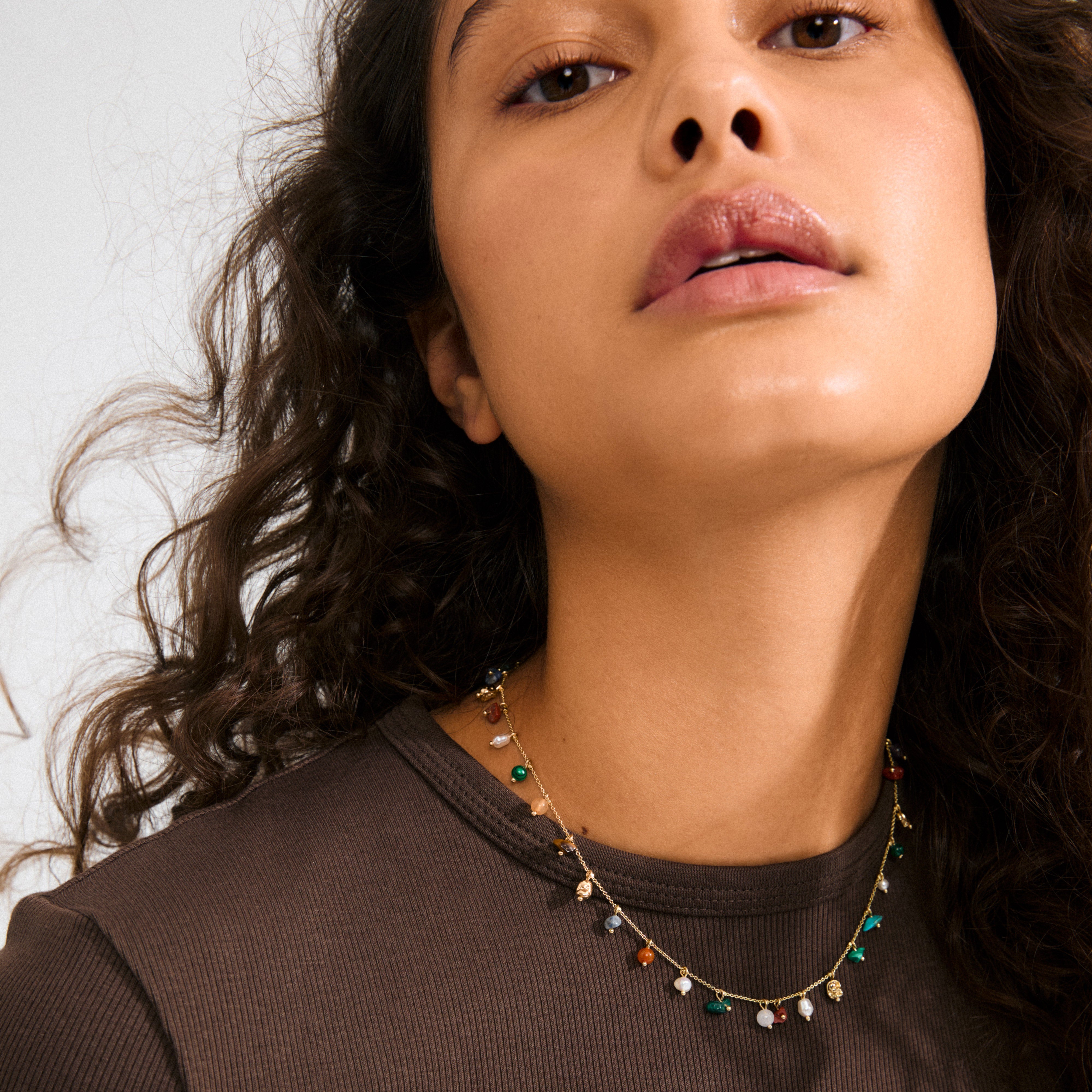 Close-up of the BETWEEN necklace, gold-plated with vibrant semi-precious stones, showcasing Pilgrim's luxe boho style and craftsmanship.