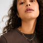 Close-up of the BETWEEN necklace, gold-plated with vibrant semi-precious stones, showcasing Pilgrim's luxe boho style and craftsmanship.