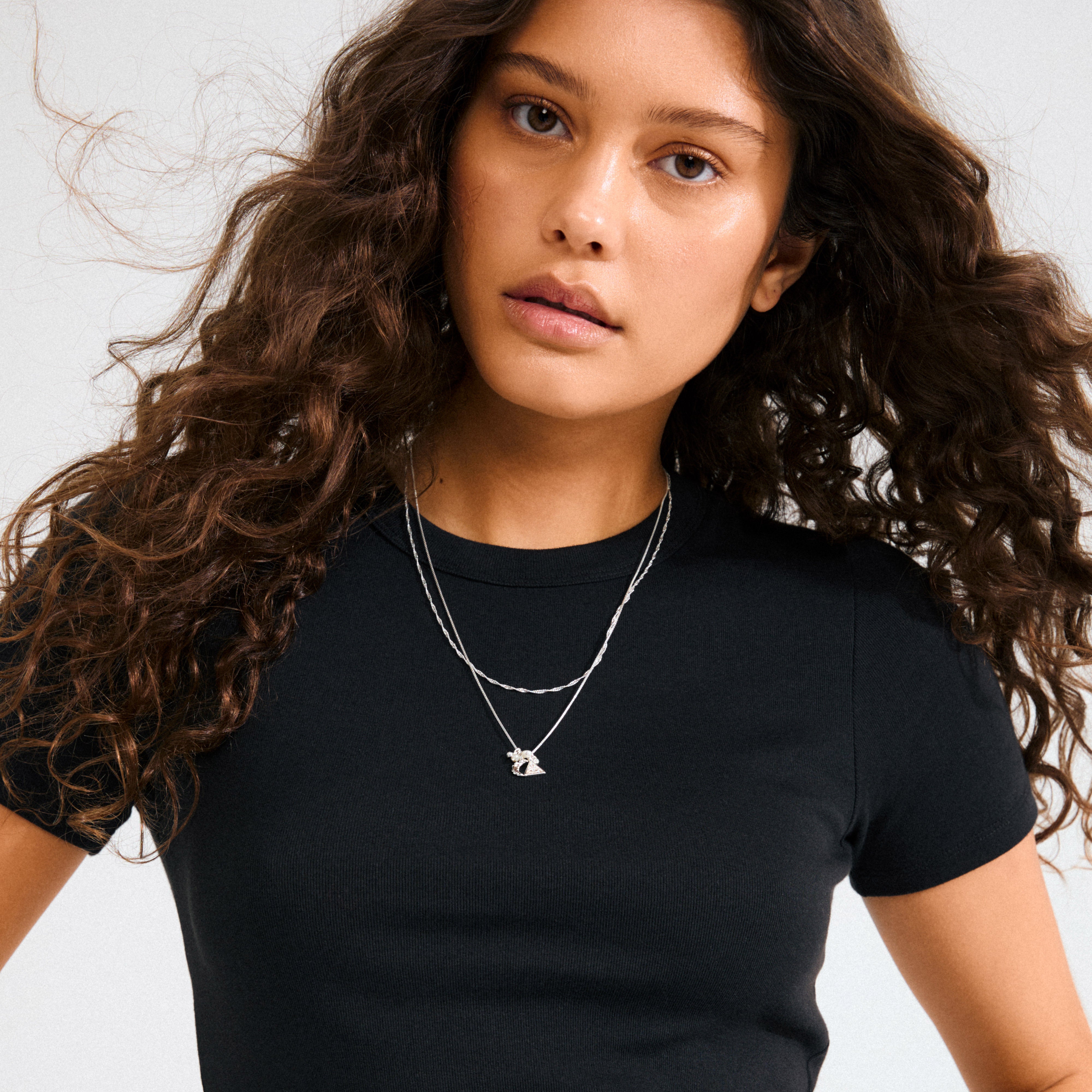 BETWEEN necklace 2-in-1 silver-plated featuring a sleek box chain and twisted chain with eye, moon, pearl, and crystal pendants, embodying bohemian magic.