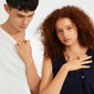 Two young people display Pilgrim's SENSE gold-plated agate rings, highlighting their sleek, minimalist design and organic beauty against a clean backdrop.