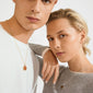 Two individuals wearing pendant necklaces, featuring the Pilgrim SENSE necklace with a Tiger Eye stone on a silver chain, showcasing modern Scandinavian craftsmanship.
