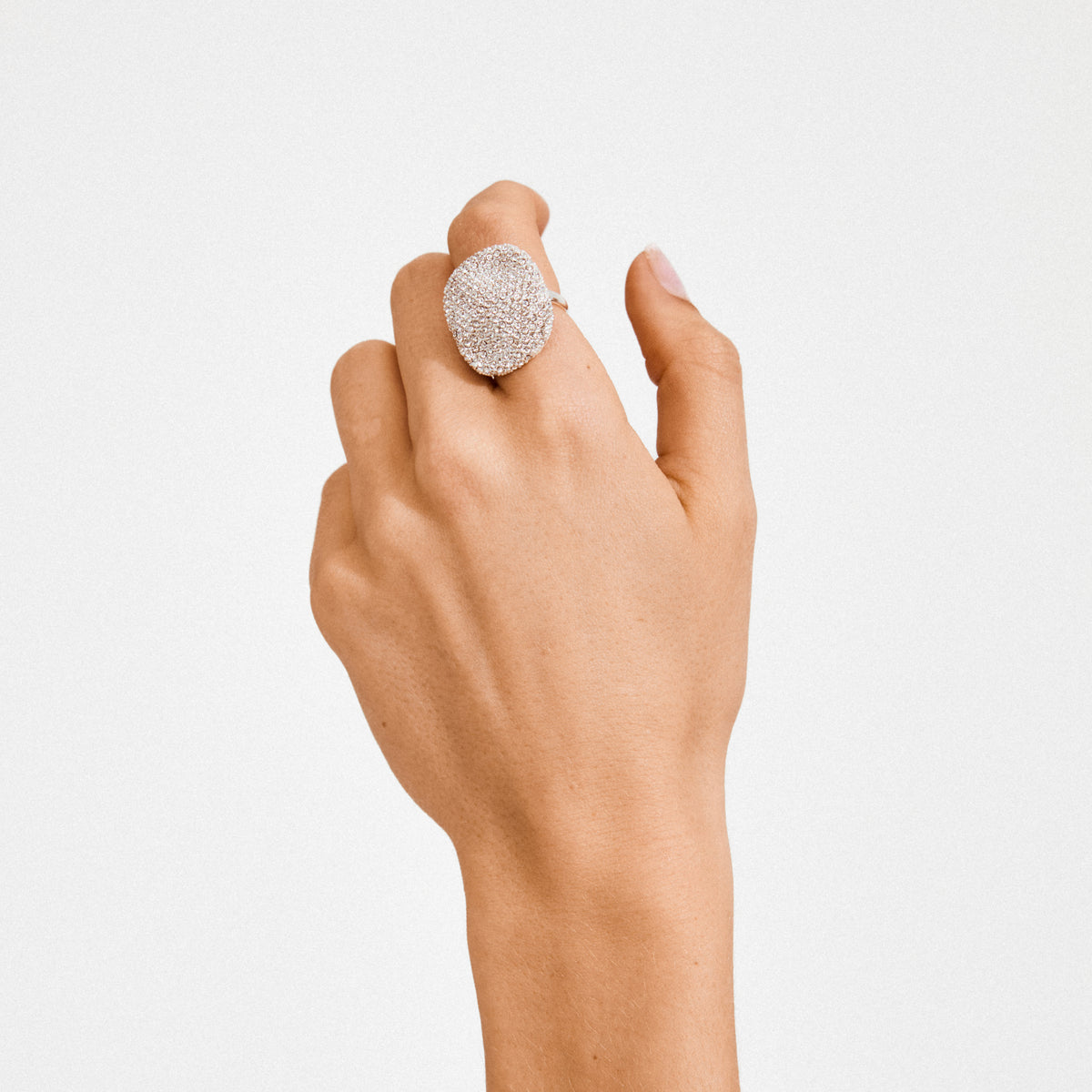 EMBER ring silver-plated on hand, featuring a bold, oval encrusted design with sparkling Preciosa crystals, capturing Pilgrim's trendy, timeless Danish craftsmanship.