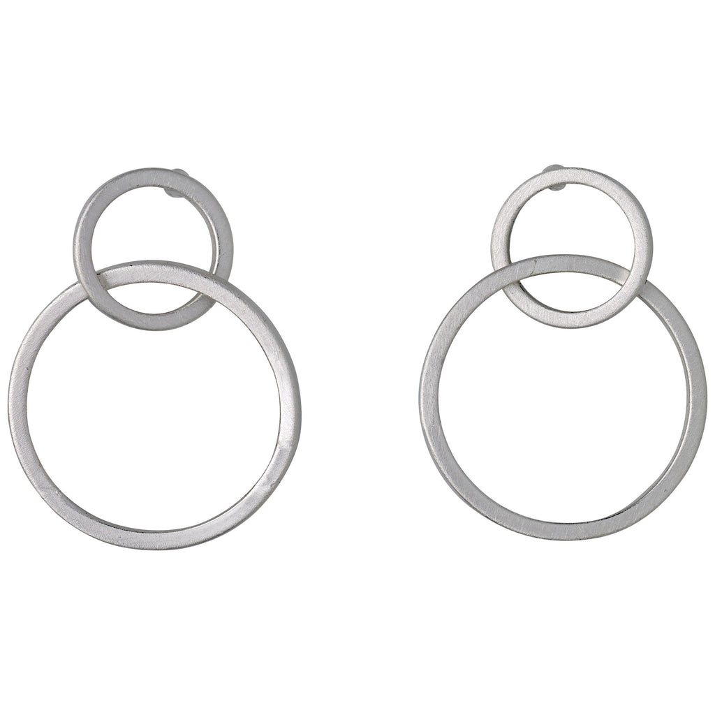 HARPER silver-plated earrings featuring two satin-matte intertwined hoops, showcasing elegant Nordic design and timeless Scandinavian craftsmanship by Pilgrim.
