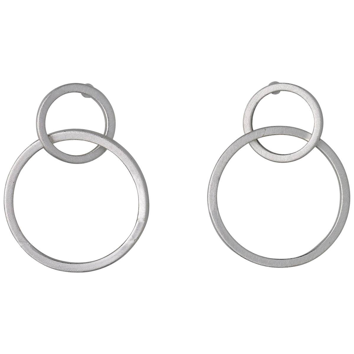 HARPER silver-plated earrings featuring two satin-matte intertwined hoops, showcasing elegant Nordic design and timeless Scandinavian craftsmanship by Pilgrim.
