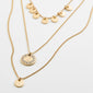 ARDEN 3-in-1 crystal necklace gold-plated showcases layered chains with disk pendants and crystals, offering a detailed, unique, and feminine touch to your décolletage.
