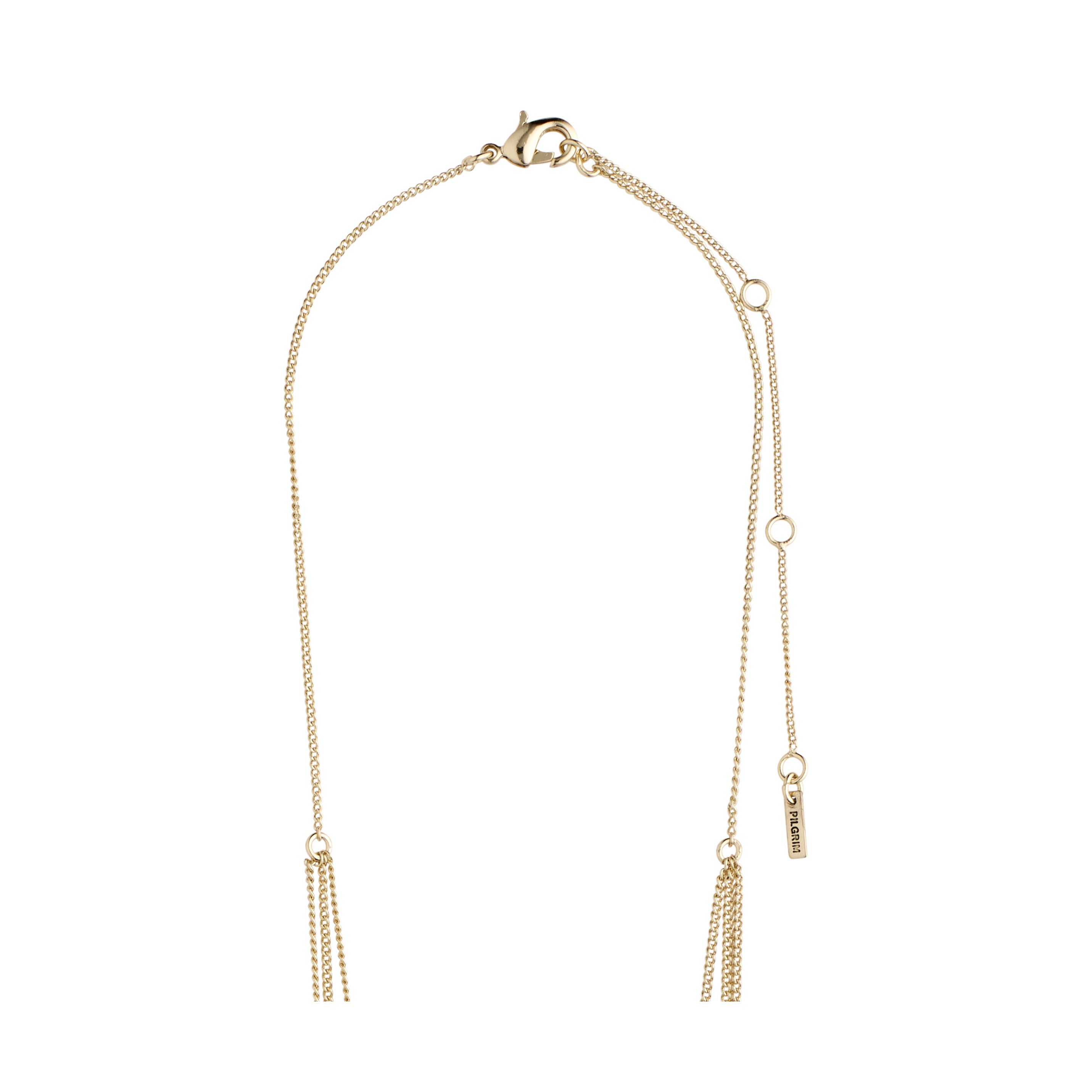 ARDEN 3-in-1 crystal necklace gold-plated features a lariat style with tassel chains, rustic amulets, and sparkling crystals, showcasing Pilgrim's unique, feminine design.
