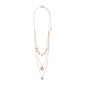 ARDEN 3-in-1 crystal necklace in rose-gold features layered chains with flat charms, a starburst pendant, and hammered disc, exuding a unique, feminine, ethnic-inspired elegance.