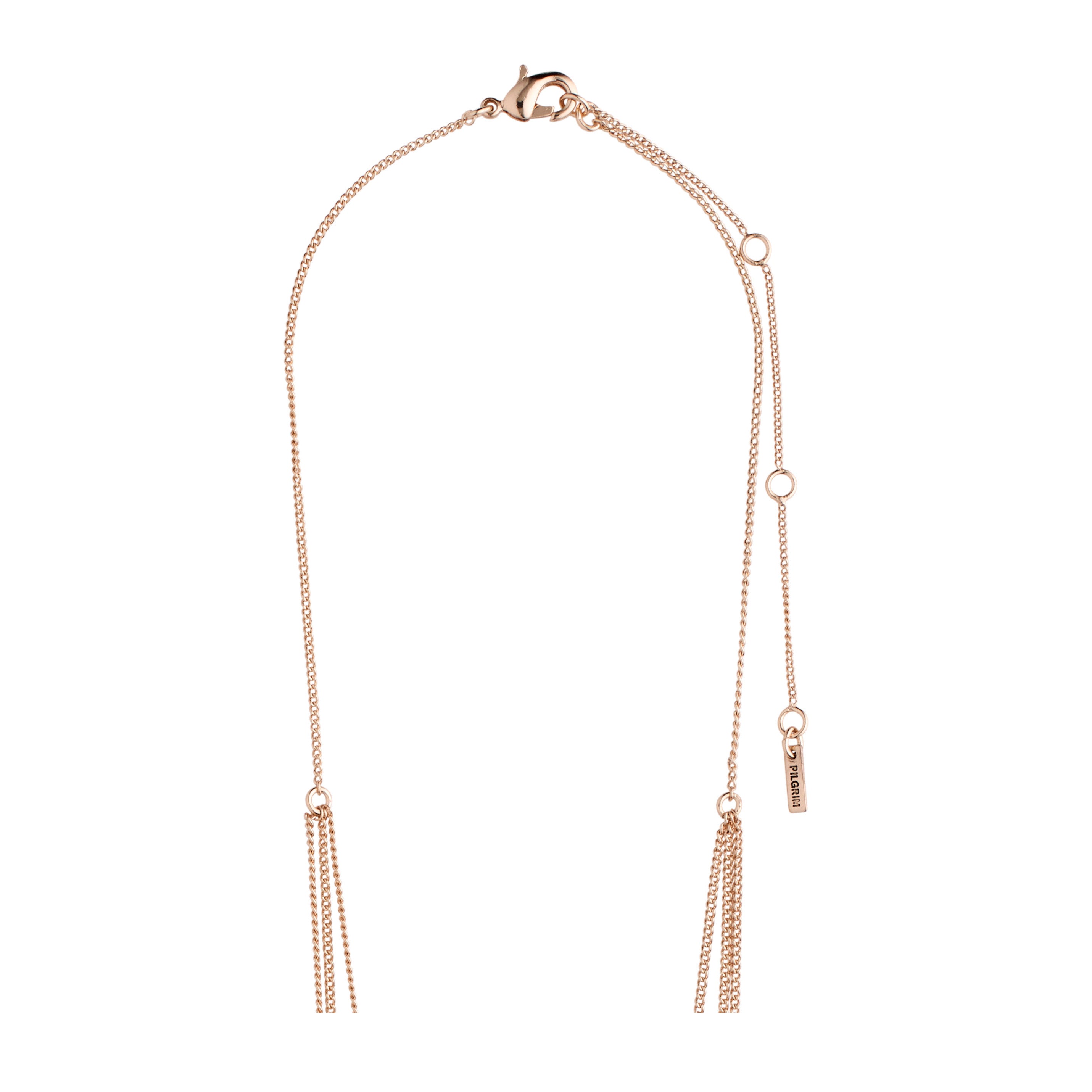 ARDEN 3-in-1 crystal necklace, rosegold-plated, features a tassel, adjustable chain, and Pilgrim branding tag, offering a unique, feminine ethnic-inspired design with rustic amulets and crystals.