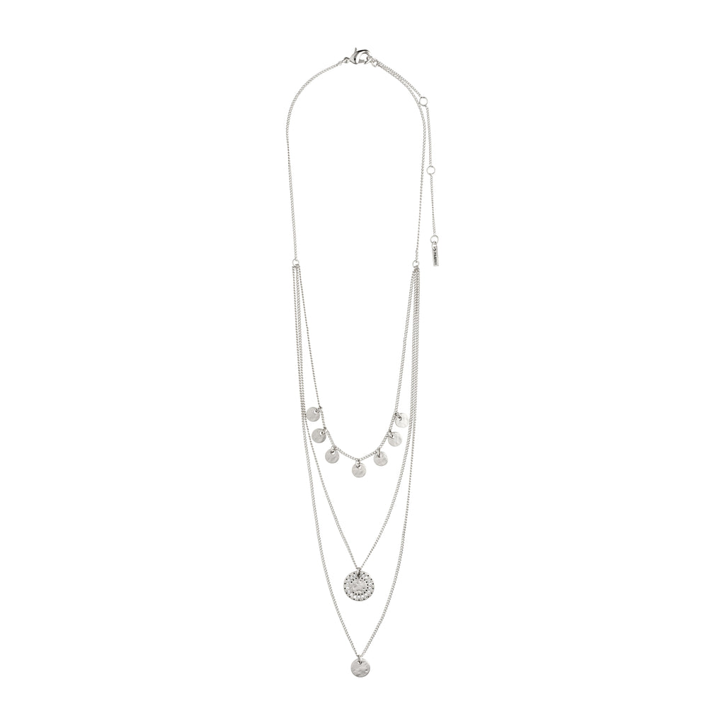 The ARDEN 3-in-1 crystal necklace, silver-plated, features rustic amulets and sparkling crystals, creating a detailed, feminine look with an ethnic touch.