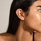 PEACE semi-precious stone hoop earrings: Gold-plated hoops with asymmetrical pendants and semi-precious stones, offering a luxurious boho look with trendy, airy elegance.