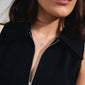Woman wearing CONNECT crystal necklace, silver-plated with organic pendant and Preciosa crystals, enhancing a casual, classy style. Perfect for adding sparkle to everyday fashion.