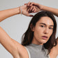 CONNECT crystal bracelet silver-plated showcased on a woman's wrist, featuring a wavy design and sparkling crystals, embodying trendy elegance and sustainable craftsmanship.