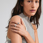 Woman wearing Pilgrim's CONNECT 2-in-1 set crystal ring silver-plated, showcasing a sleek design with one ring featuring sparkling crystals, emphasizing trendy elegance.