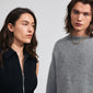 CONNECT necklace silver-plated: A man and woman admire each other, highlighting the necklace's layered design and unique twisted links, embodying Pilgrim's trendy, inclusive style.