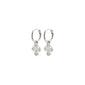 DAGMAR huggie hoop earrings, silver-plated, featuring mini Dagmar Crosses, crafted from 99% recycled material, offering a modern twist on a Danish classic.