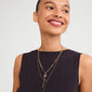 BREEZE necklace 2-in-1 set gold-plated, featuring a woman smiling while wearing layered chains with a turtle charm and pearl pendant.