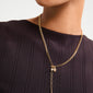 BREEZE necklace 2-in-1 set, featuring a gold-plated anchor chain with turtle charm and freshwater pearl pendant, worn by a person.