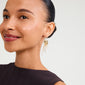 Close-up of a woman wearing BREEZE chain earrings, featuring asymmetric gold-plated chains with freshwater pearls, capturing a bohemian-chic look.
