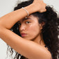 BREEZE bracelet silver-plated on a woman's wrist, featuring layered chains with pearls and sparkling crystals, embodying romantic summer vibes.