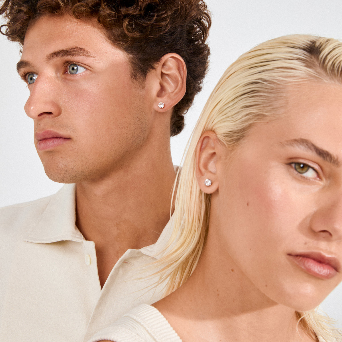 Two models showcase the ORIGINAL crystal earstuds silver-plated, highlighting their sparkling Preciosa stones. A chic, versatile accessory perfect for elevating any outfit with subtle glam.