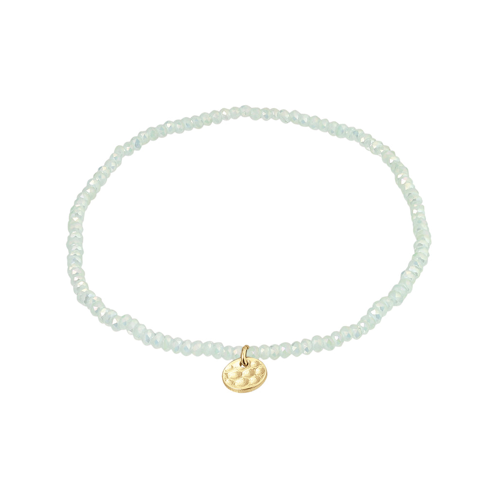 INDIE bracelet featuring gold-plated charm and mint glass beads, designed for versatile style on durable Lycra elastic. Perfect for layering with similar styles.