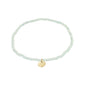 INDIE bracelet featuring gold-plated charm and mint glass beads, designed for versatile style on durable Lycra elastic. Perfect for layering with similar styles.