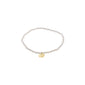 INDIE bracelet: white beaded design with a gold-plated disc pendant, crafted from faceted glass beads, strung on Lycra elastic, fitting most wrists.