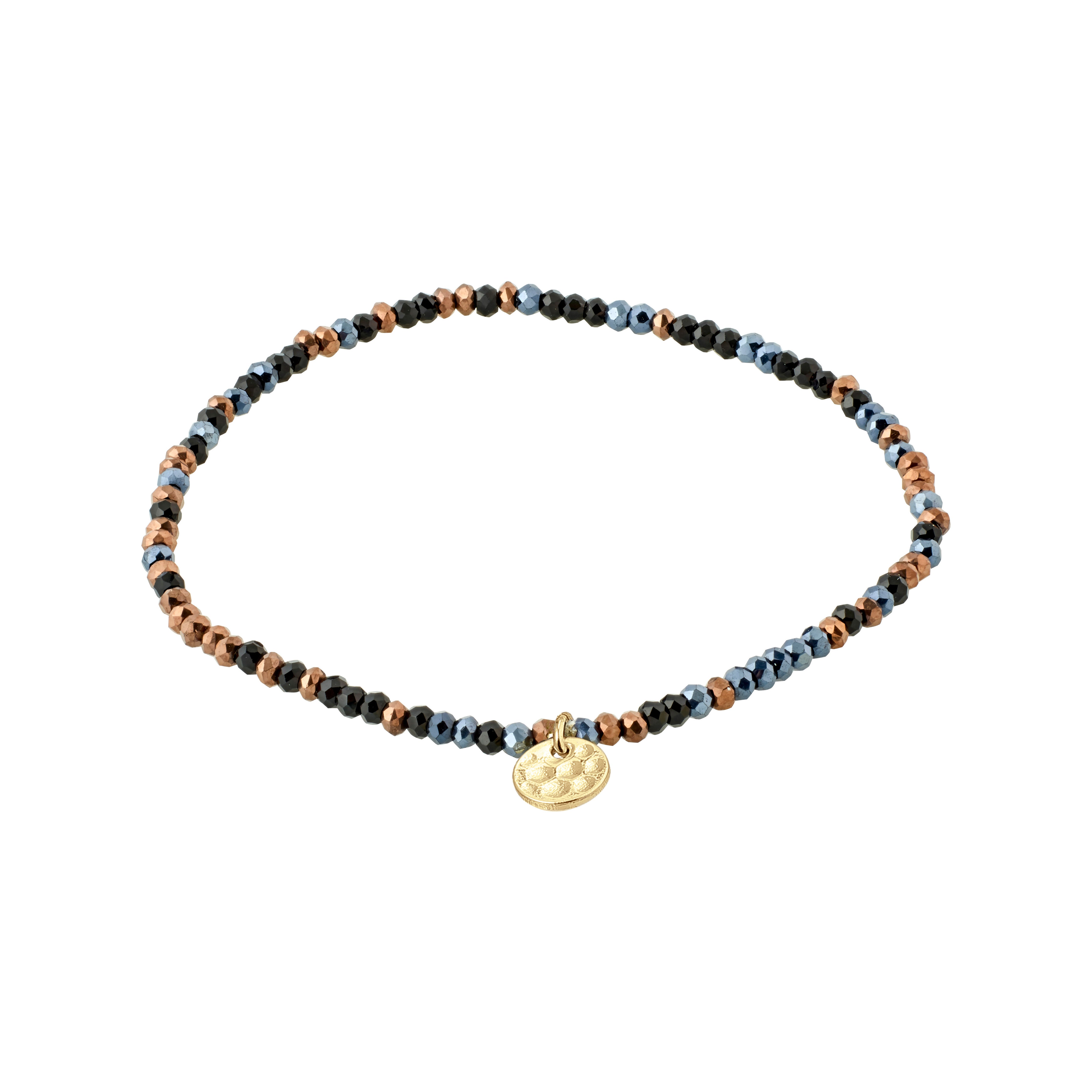 INDIE bracelet features dark grey faceted glass beads with a gold-plated Pilgrim logo charm, strung on durable Lycra elastic for versatile wrist fitting.