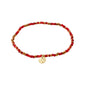 INDIE bracelet red, gold-plated, features red faceted glass beads and a discreet gold-plated Pilgrim logo, strung on durable Lycra elastic for a versatile fit.