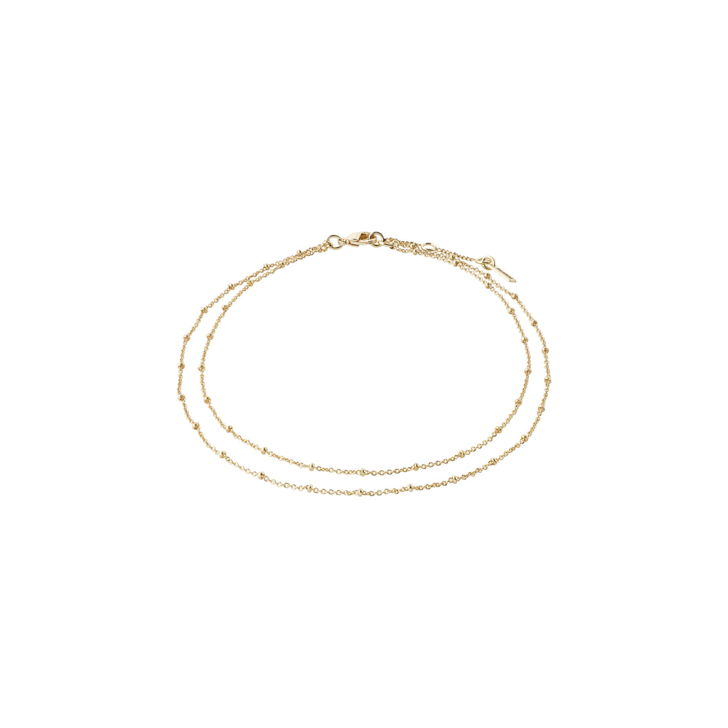ELKA ankle chain 2-in-1 gold-plated, featuring two delicate chains with round pendants, perfect for adding elegance and shine to summer outfits.