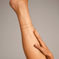ELKA ankle chain 2-in-1 gold-plated, featuring two elegant chains with round pendants, enhancing style and sophistication, perfect for a chic summer look.