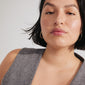 Woman wearing STAR gold-plated hoops from Pilgrim, featuring an elegant oval shape with Preciosa crystals, showcasing a stylish, modern look.