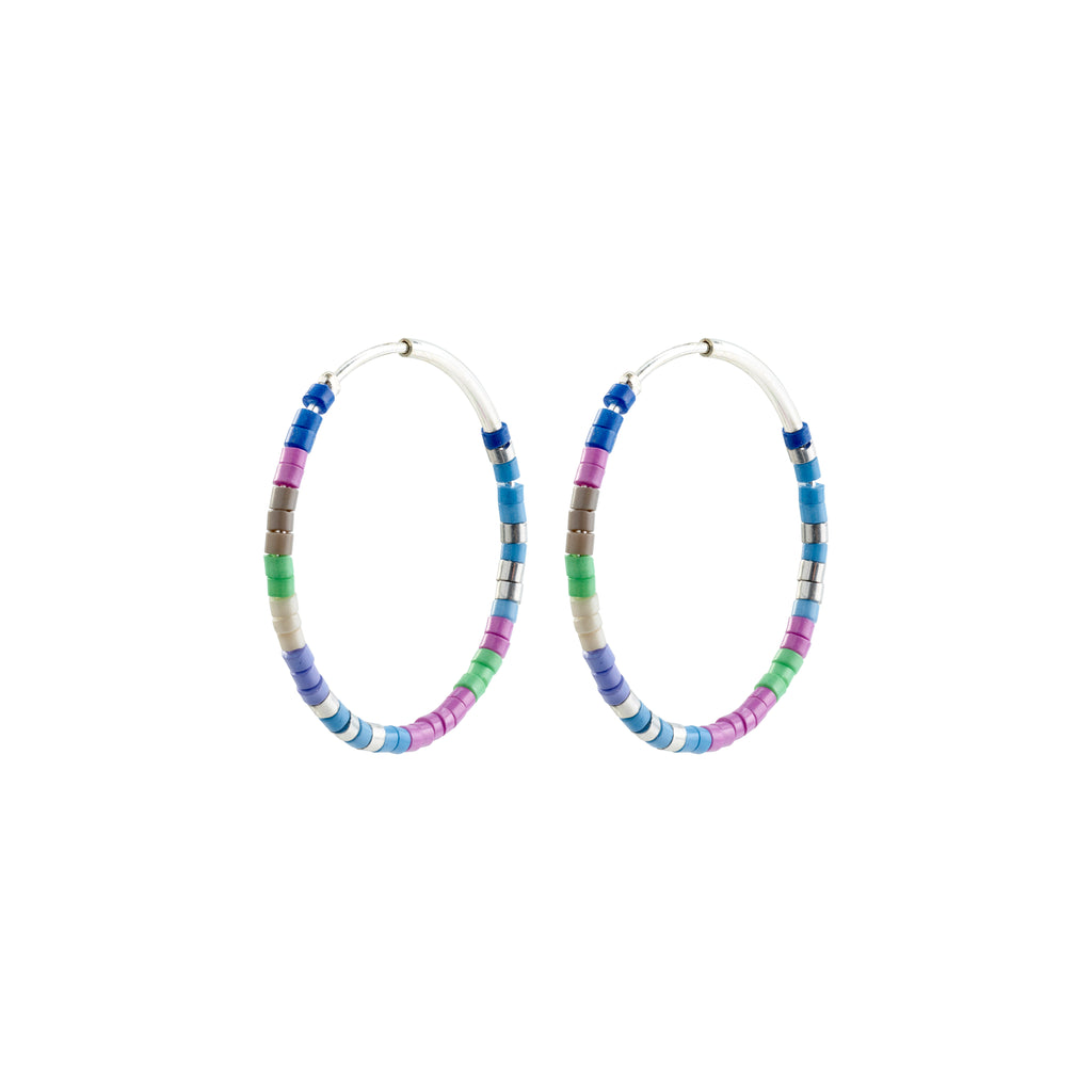 ALISON hoop earrings, blue/silver-plated, feature vibrant glass beads in blue and purple, embodying Pilgrim's Scandinavian-inspired, trendy design. Perfect for a summery, stylish look.