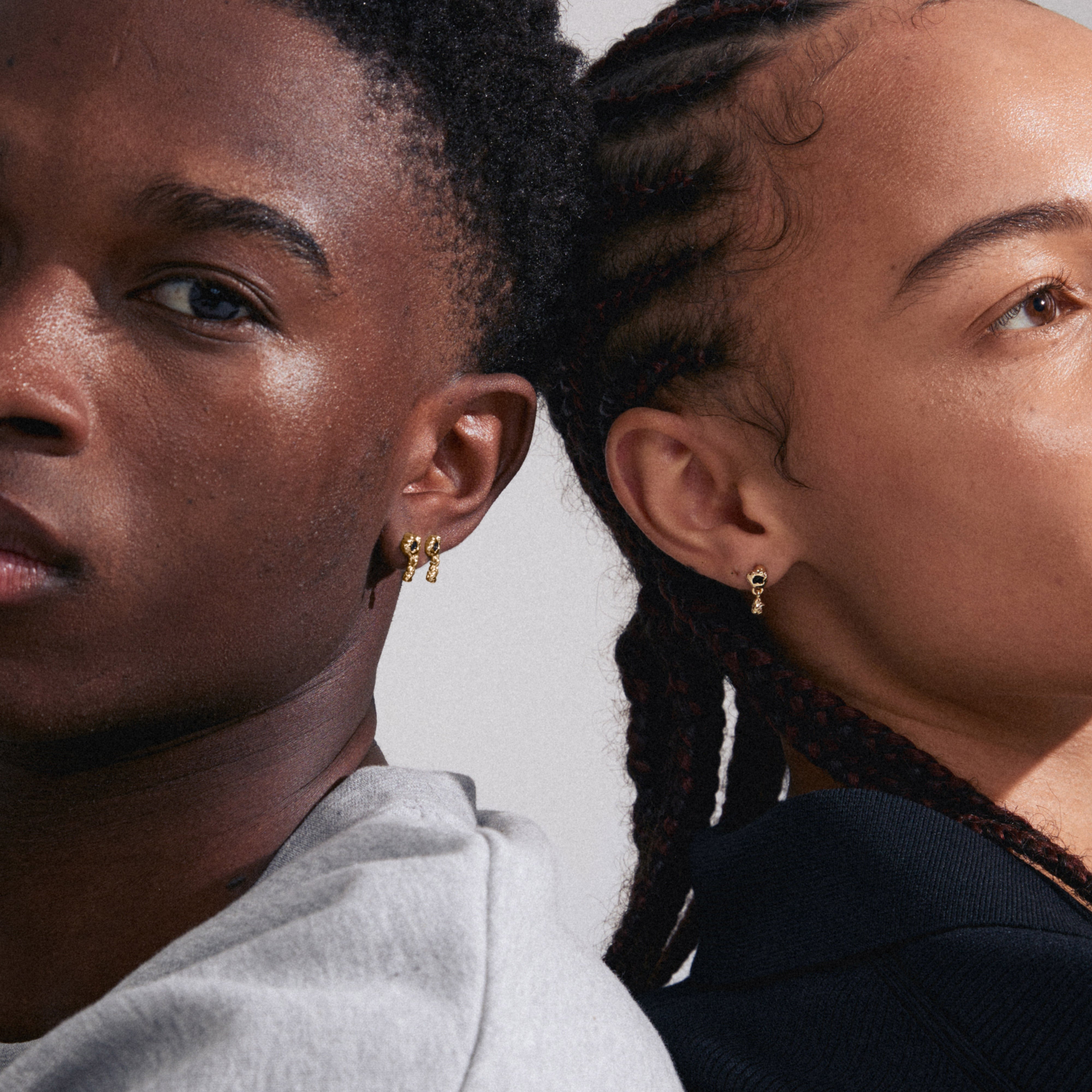 RYPER earrings gold-plated in focus, showcasing a teardrop-shaped black Agate stone pendant, ideal for adding subtle elegance to everyday styles.
