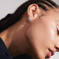 Close-up of a woman wearing PRISCILLA silver-plated earrings with shimmering Preciosa crystals, emphasizing a bold, statement-making accessory for a curated ear look.
