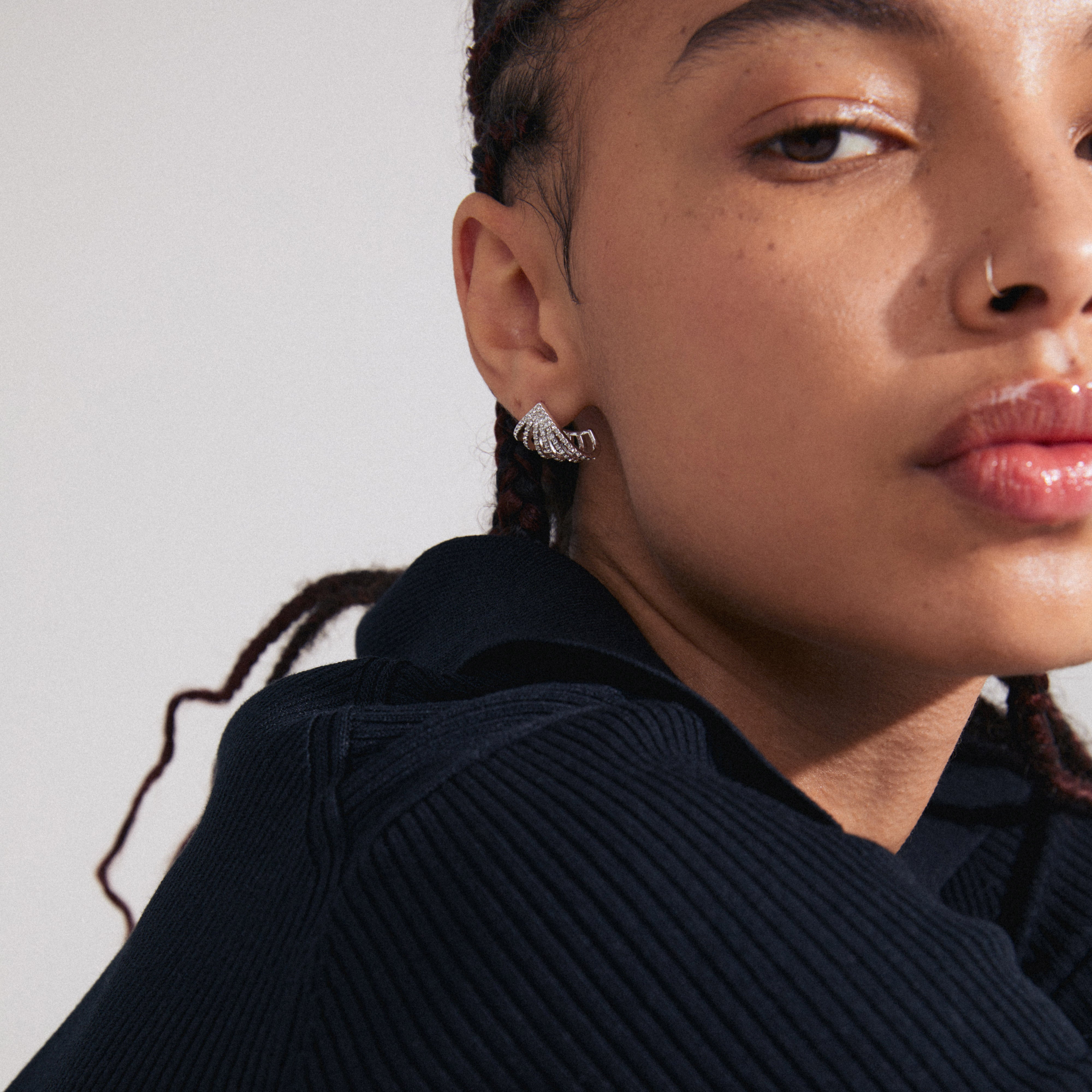 Silver-plated PRISCILLA earrings encapsulate earlobes with shimmering Preciosa crystals, offering a statement look and enhancing everyday style with recycled, Scandinavian-inspired design.